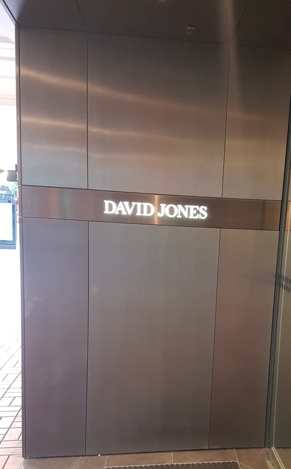 Bronze coated brass cladding glued to ceilings and walls to all the entrances into David Jones department store